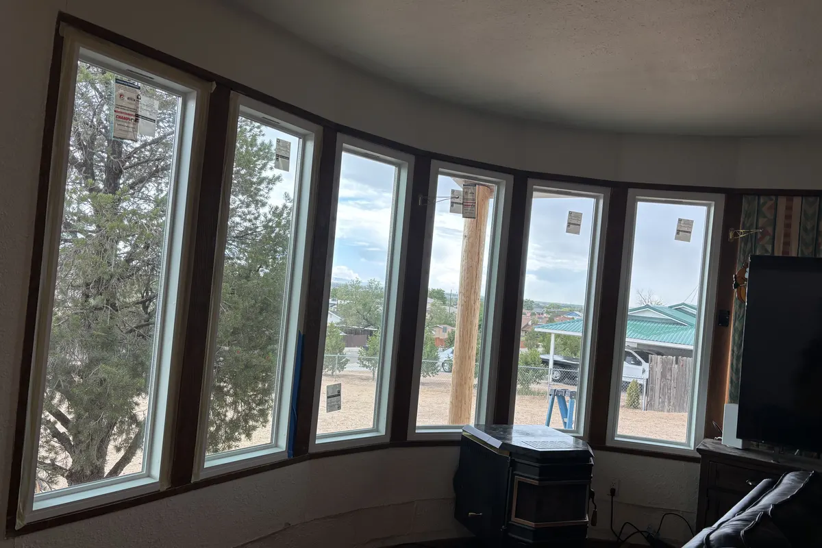 Bay window with wood frames seen from inside a room